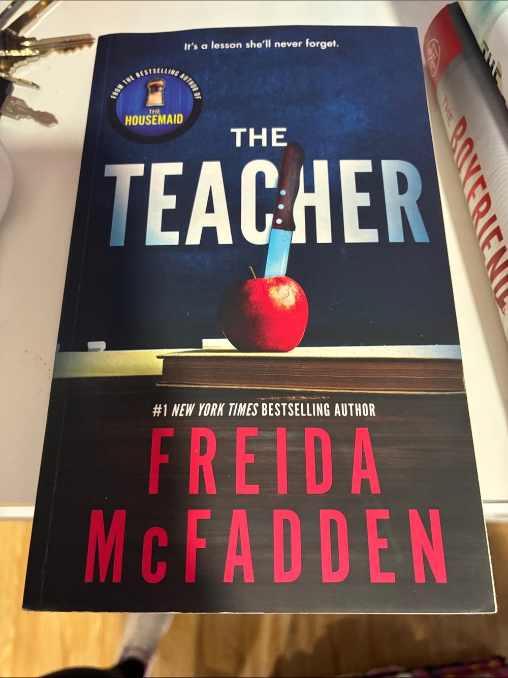 The Teacher by Freida McFadden - Navy & Red Paperback Thriller